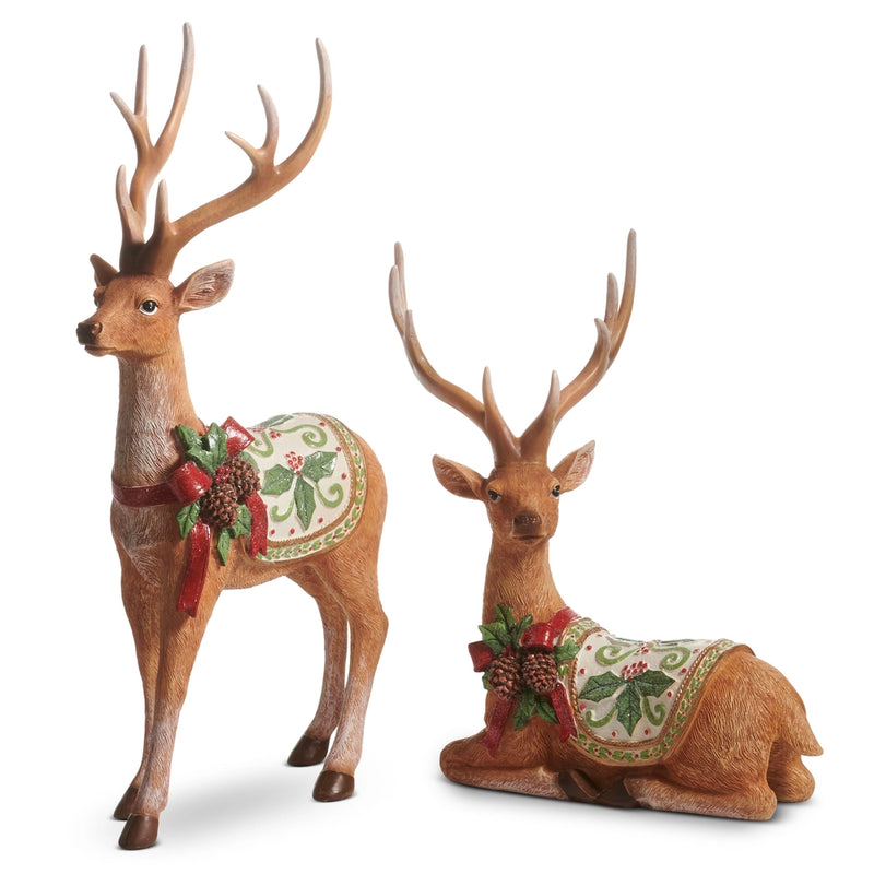 Two decorative deer figures with antlers on a white background