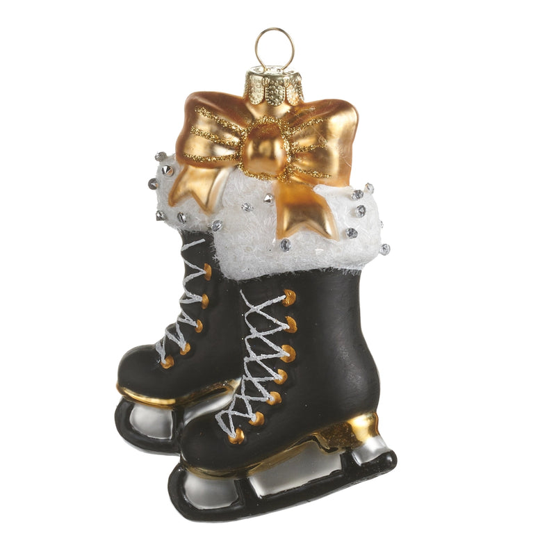 Decorative ice skates with a gold bow on a white background