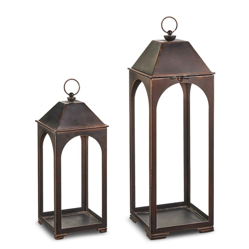Two bronze lanterns on a white background