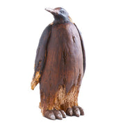 Wooden penguin figurine on a white background