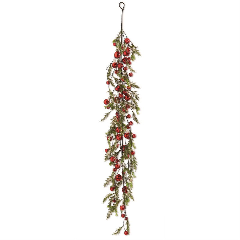 A garland of green pine branches with red jingle bells and brown holly leaves, designed for Christmas decoration.