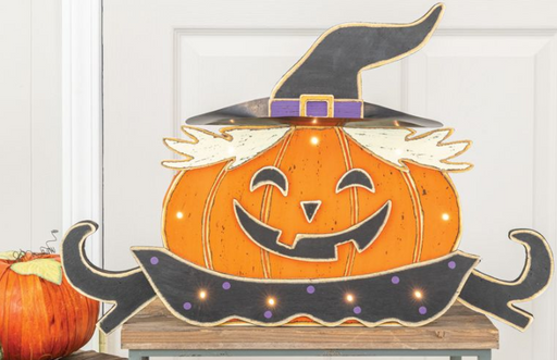 Decorative Halloween sign with a pumpkin and witch hat on a white background