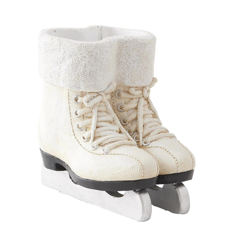 Pair of white ice skates with textured top on a white background