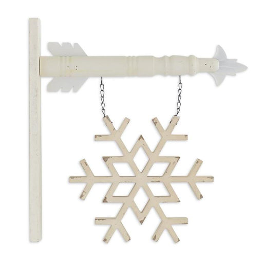 Decorative snowflake ornament hanging from a chain on a white background