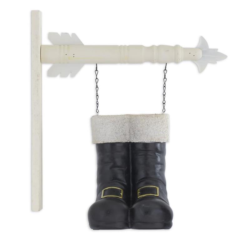 Decorative wall hanging with black boots and a white cincture on a white background