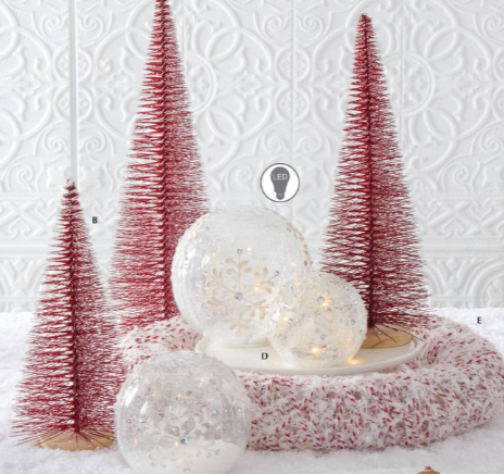 Decorative Christmas scene with red trees and white ornaments on a textured white background