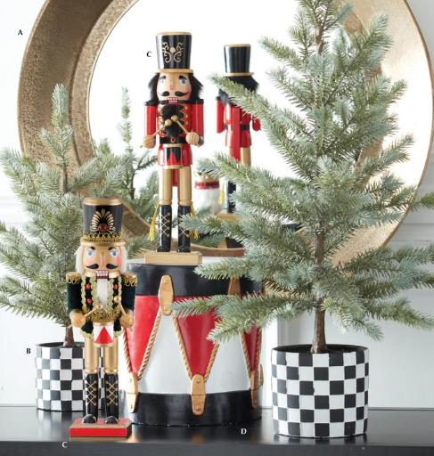 Decorative nutcrackers with a Christmas tree and checkered pots on a white background