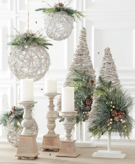 Decorative Christmas scene with spherical ornaments, candle holders, and trees on a light background.