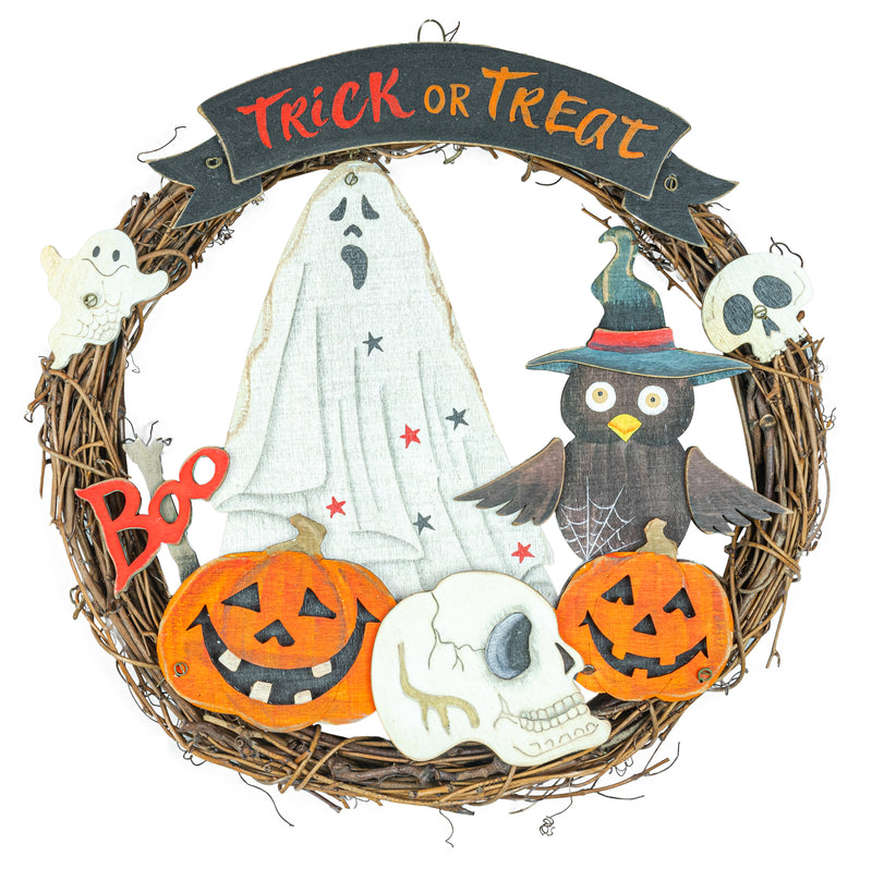 A circular Halloween wreath made of brown grapevine branches, decorated with a white ghost, a black owl in a witch hat, two orange jack-o'-lanterns, white skulls, a small white ghost, red stars, and a black banner at the top that reads “Trick or Treat.”.