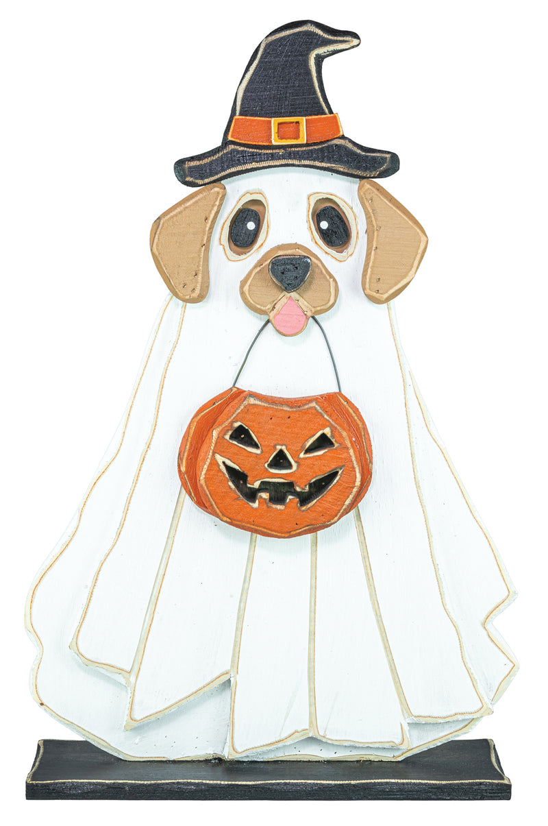 A decorative Halloween dog-shaped sign or plaque dressed as a ghost, wearing a black witch hat with an orange band and holding an orange jack-o'-lantern bucket, shown on a plain white background.