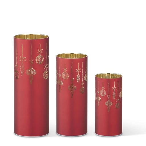 Three red cylindrical containers with gold decorative elements on a white background