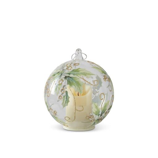 Decorative glass ball with a candle inside on a white background