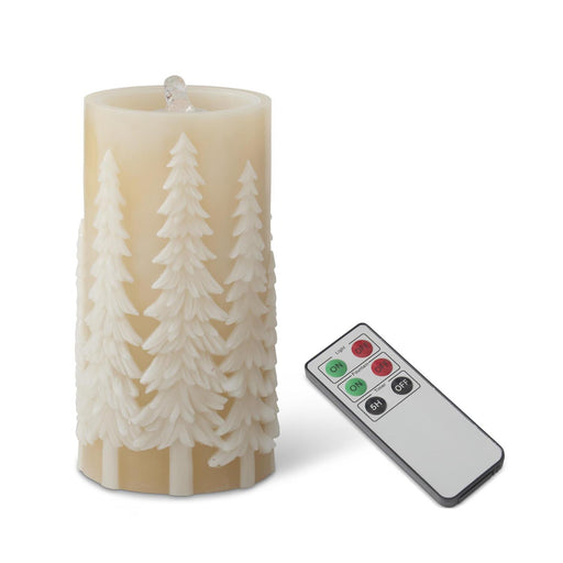Flickering candle with tree design and remote control on a white background