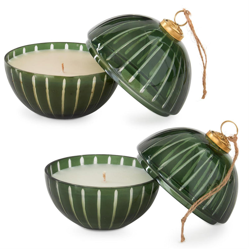 Green glass candle holders with striped design and gold accents on a white background