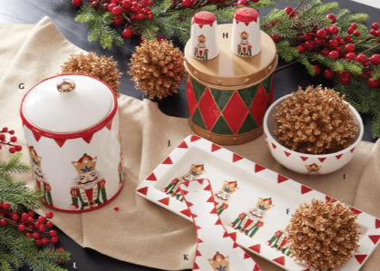 Decorative kitchen items with Christmas theme on a table with festive decorations.