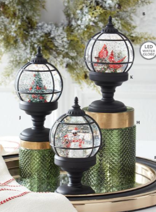 Decorative Christmas globes on a tray with a blurred background
