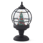 Decorative snow globe with a Christmas tree on a white background