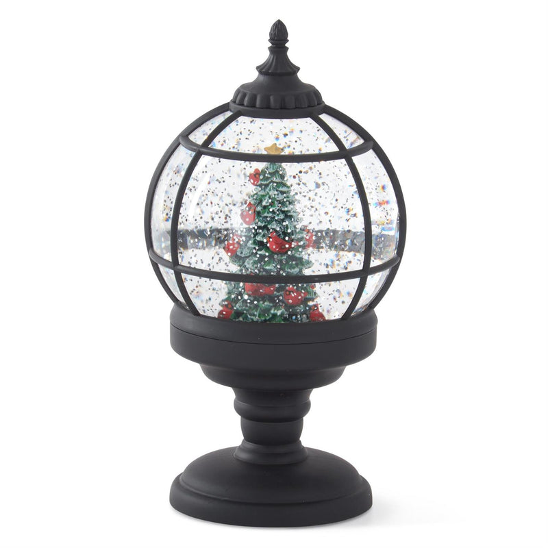 Decorative snow globe with a Christmas tree on a white background