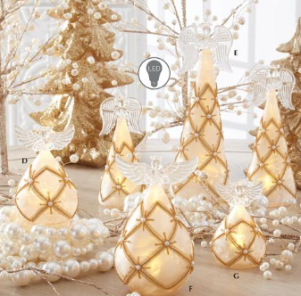 Decorative lights and ornaments on a wooden surface with a blurred background