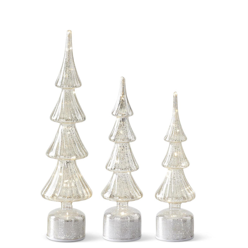 Set of three silver Christmas tree decorations on a white background