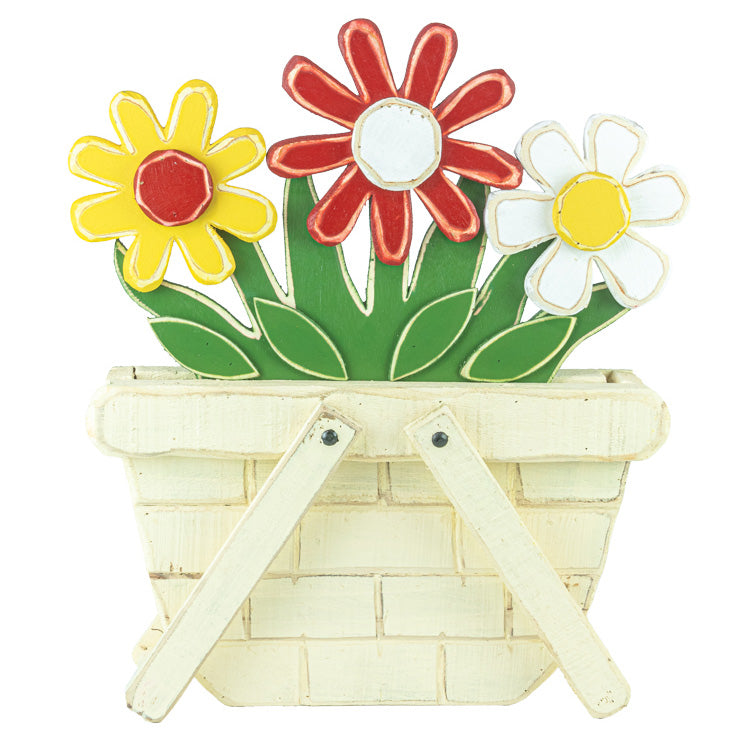 A decorative wooden basket wall hanging with three colorful flowers in yellow, red, and white, set against a plain white background.