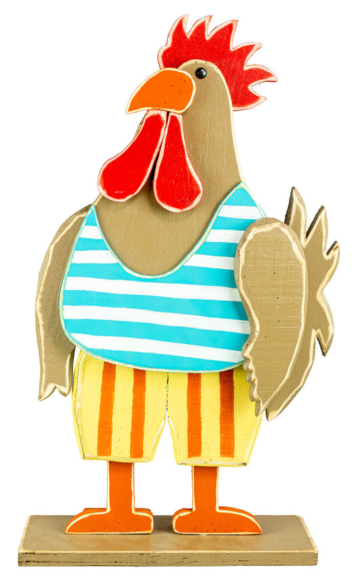 A whimsical wooden rooster figurine wearing a blue and white striped shirt and yellow striped shorts, standing on a small wooden base against a white background.