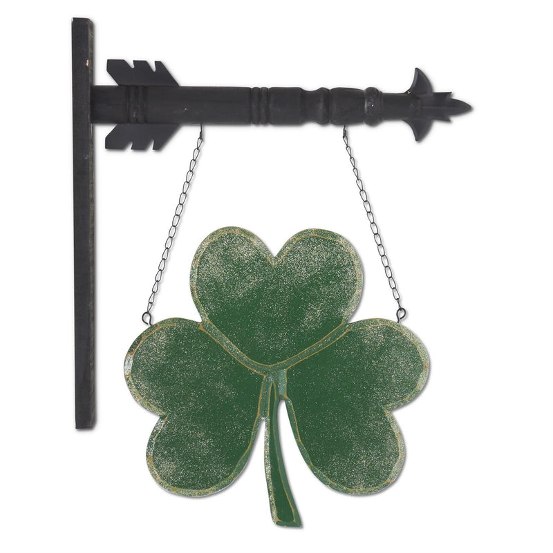 Decorative metal sign with a three-leaf clover and arrow on a white background