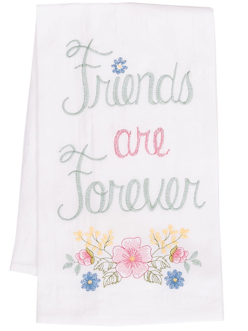 A white flour sack kitchen towel with pink and green floral embroidery and the text 'Friends are Forever'.