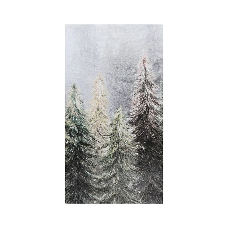 Kitchen towel with art of a snowy forest scene with tall trees.