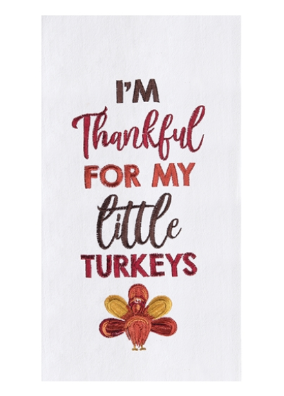 A kitchen towel with an embroidered message 'I'm thankful for my little turkeys' in red and brown colors, with a decorative turkey in the center.