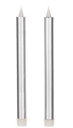 Two silver candles with white wicks on a white background