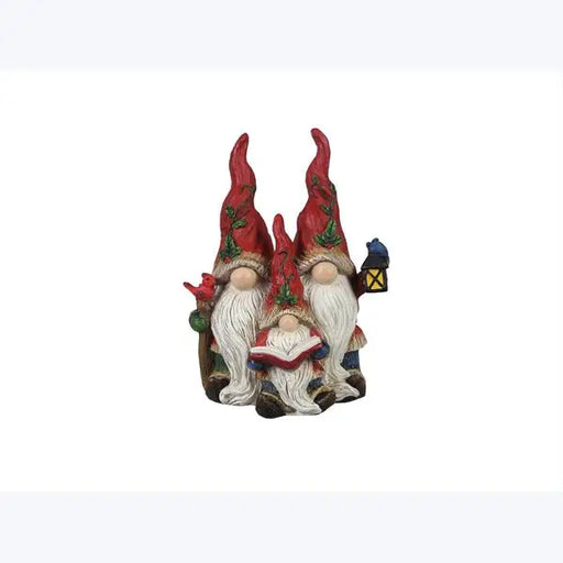 Three gnome figurines with red hats and white beards on a white background