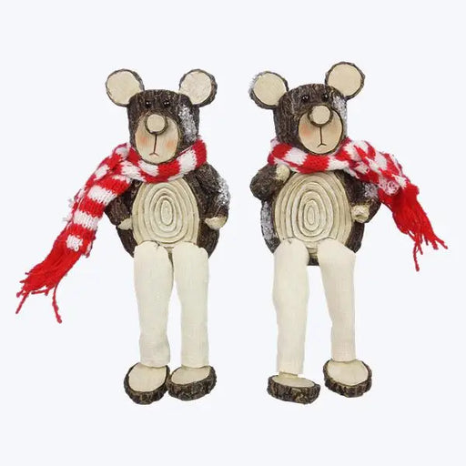 Two wooden bear figurines with red and white scarves on a white background