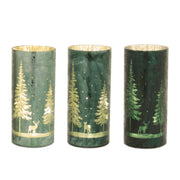 Three cylindrical candles with forest design featuring trees and deer on a white background