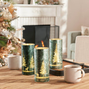 Decorative candles with forest design on a table in a cozy living room.