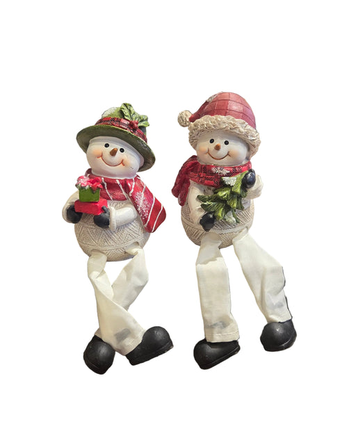 Two decorative snowmen with scarves and hats on a white background
