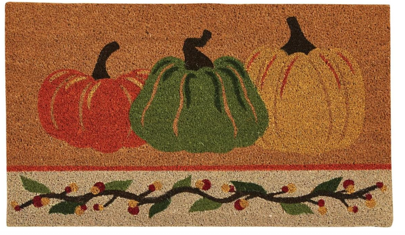 Decorative doormat with pumpkins and gourds design on a brown background
