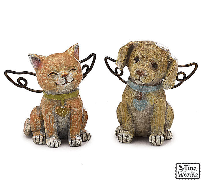 Two small figurines of a cat and a dog with collars on a white background, featuring the brand 'Tina Wenke'.