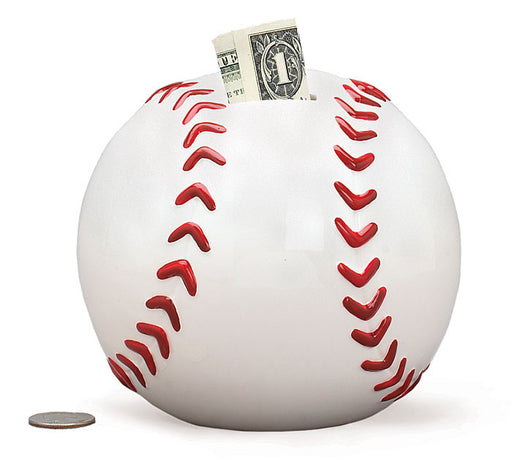 Baseball-shaped piggy bank with a dollar bill sticking out on a white background