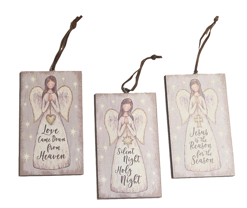 Three wooden angel decorations with Christmas messages on a white background
