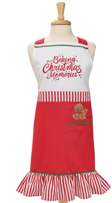 Red and white apron with Christmas-themed design on a mannequin against a white background