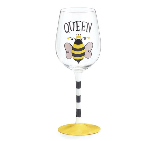 Wine glass with a bee design and 'Queen' text on a white background