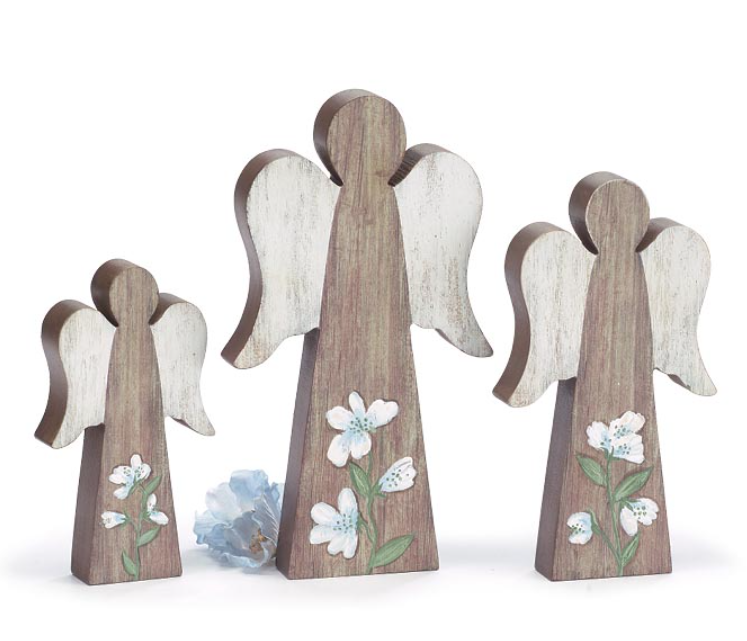 Set of three wooden angel figurines with floral designs on a white background