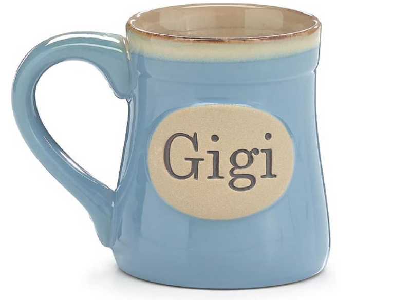 Blue mug with 'Gigi' on a beige label against a white background