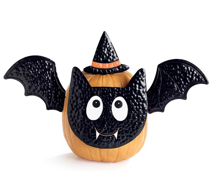 Pumpkin decorated like a bat with a witch hat on a white background