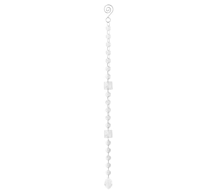 A long, narrow white beaded hanging ornament with a spiral top and a small decorative pendant at the bottom, shown on a plain white background.