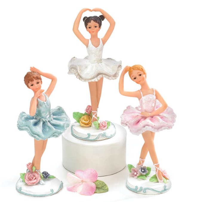 Three ballerina figurines in different poses on a white background