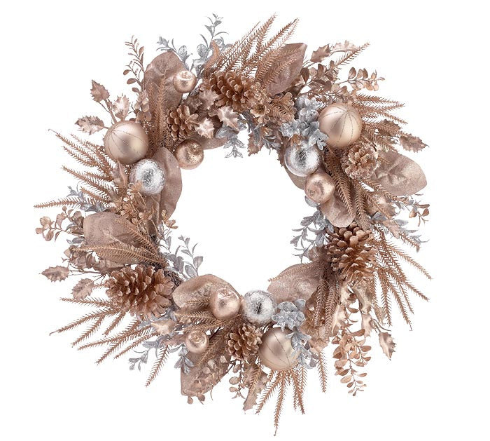 A decorative wreath made of dried botanical elements in warm metallic rose-gold and silver tones, including pinecones, leaves, pine needles, and glossy round ornaments, shown on a plain white background.