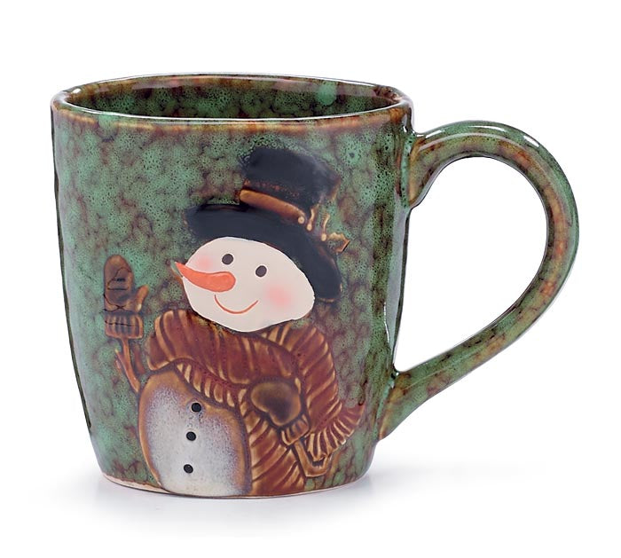 A green marbleized mug with a design of a snowman, featuring a smiling face, a red nose, and a snowy outfit on a white background.