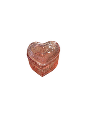 Heart-shaped pink glass box on a white background